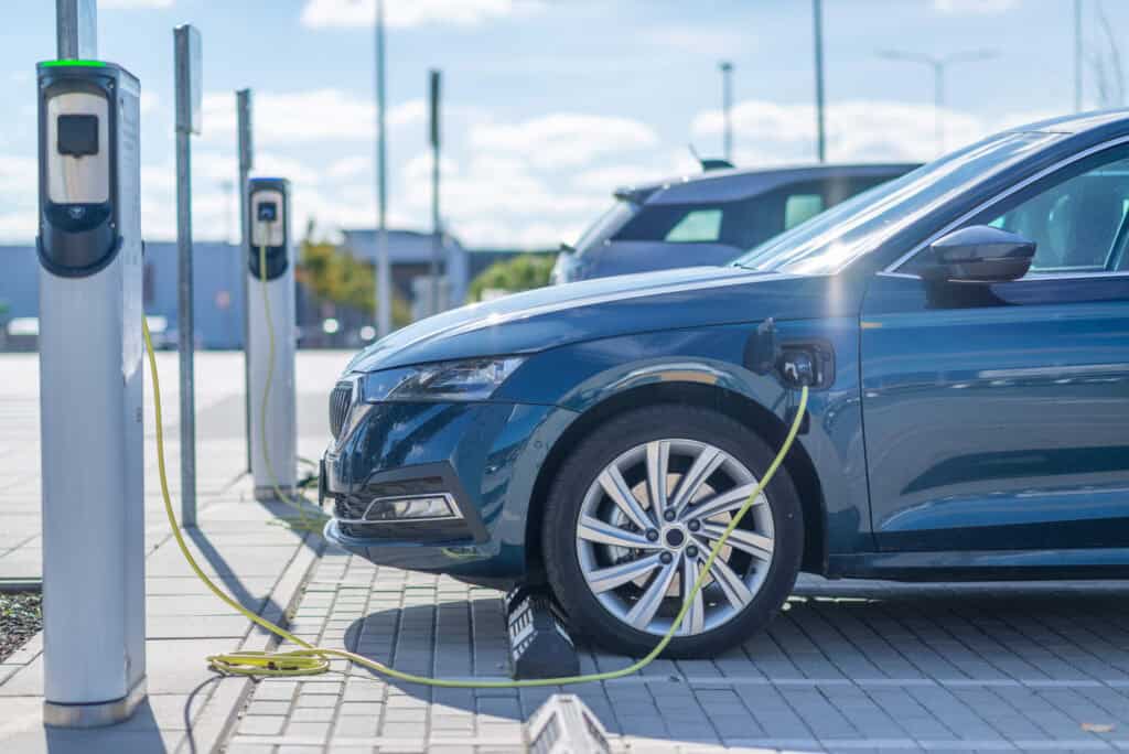 Electric car charging at a station in Europe